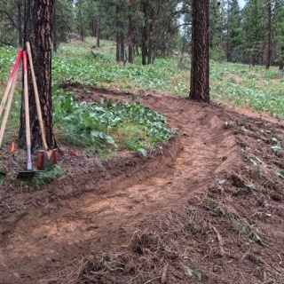 Newly cut trail, long flowing berms make for an alternative easy climbing route