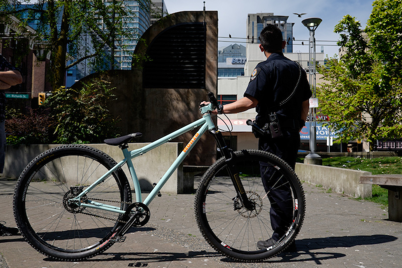 Photo: J.L. Russell - VPD holding reclaimed stolen bike.