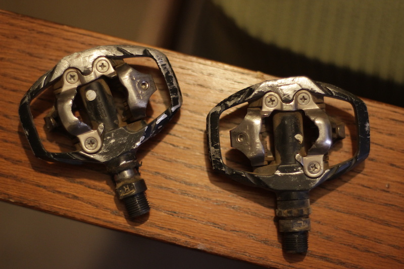 Shimano M530 SPD clips. Please note that the pedal on the left is missing half of the plastic dust shield.