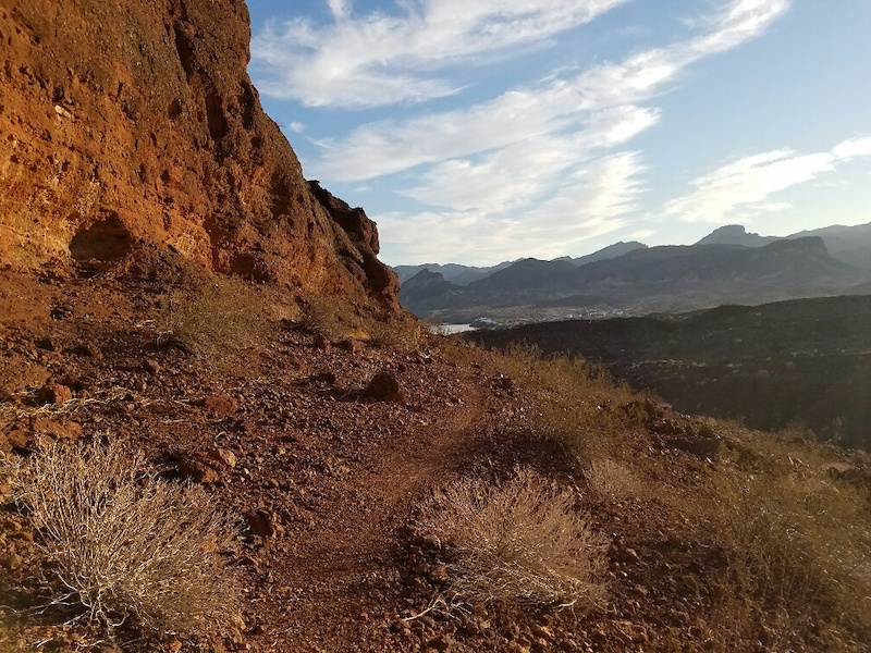 As you get closer to the lake, you'll ride along the base of this red rock bluff, very cool.