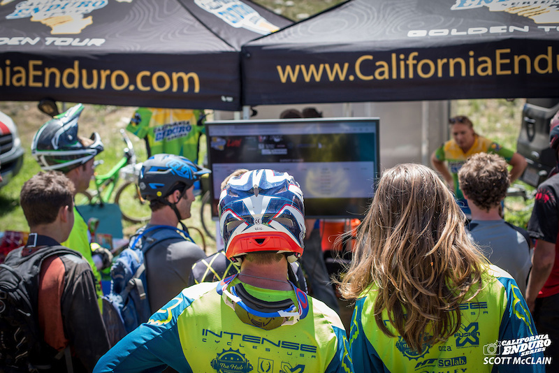 Riders check their times and standing in between stages at the CES Live timing booth.