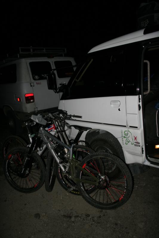 Putting bikes and gear outside the van in order to bed down for the night.