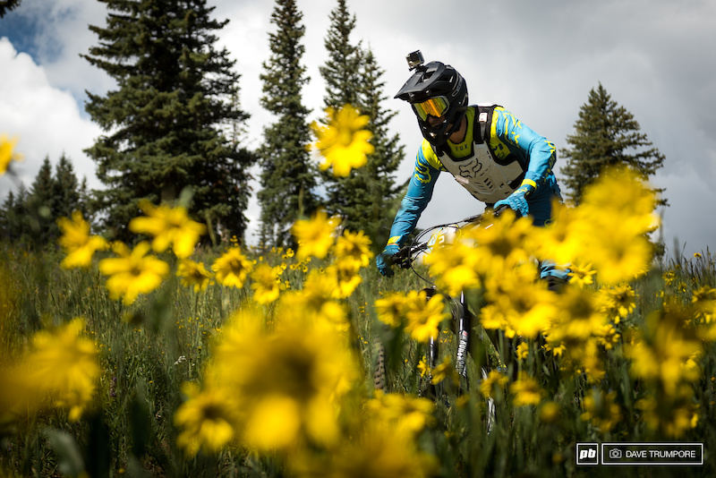Damien Oton amongst the wild flowers, and trying to find some air.  With the start of stage 2 at just over 11k feet, oxygen is limited.