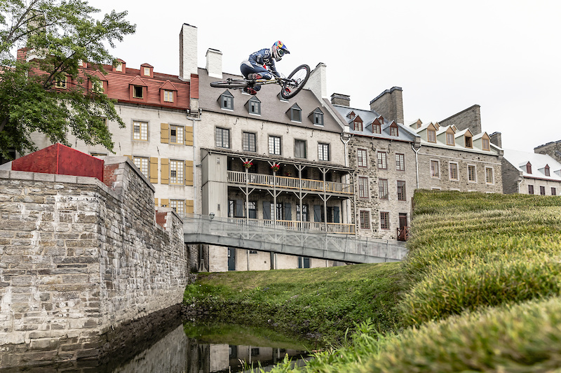 Finn Isles catches air on his downhill mountain bike during the making of Red Bull Purest Line in Quebec City, Canada on July 21, 2017.