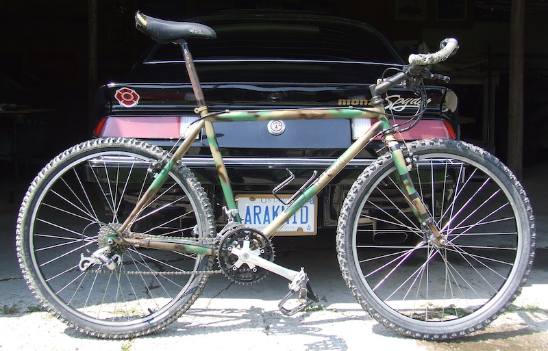 Old school 1990 Specialized Stumpjumper Comp backed by an '80 Monza Spyder.  Best on 2 and 4 wheels.