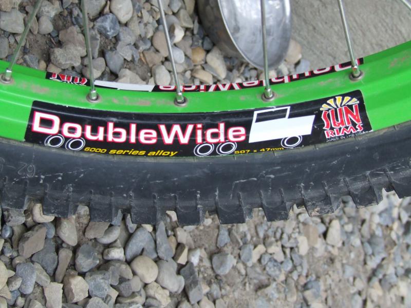 This is my back tire, I just got it this year and the whole system( tire, tube disk). 
Its a sun rim double wide!