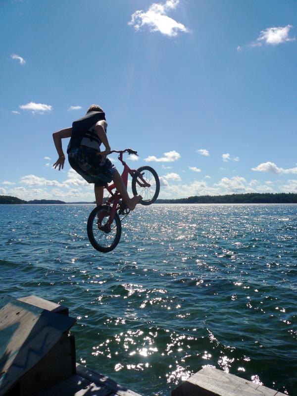 We built this jump off the dock and we were doing trick off it. I was riding my "PinkBike"m it's on old fully from costco i pianted pink and singlespeed it