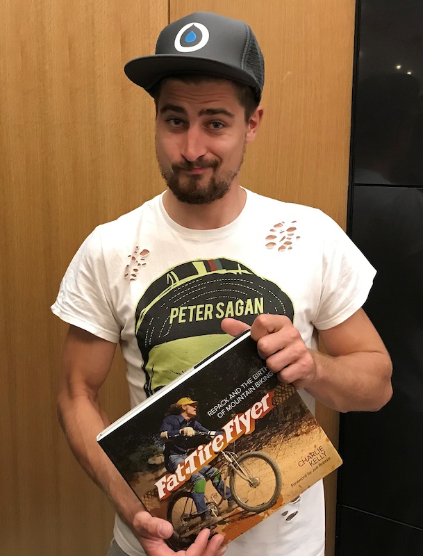 Peteer Sagan holds a copy of my book, Fat Tire Flyer