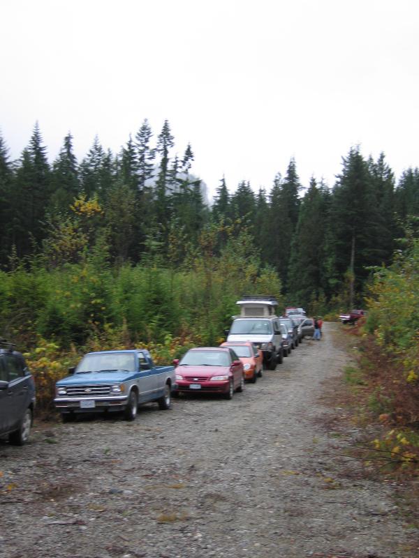 Row of cars parked at the bottom of the course.