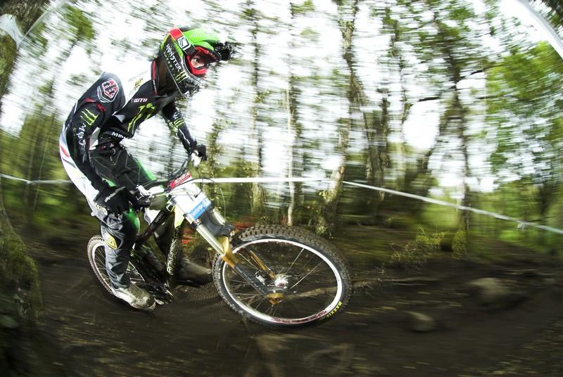Sam Hill hitting the roots on a practice run.