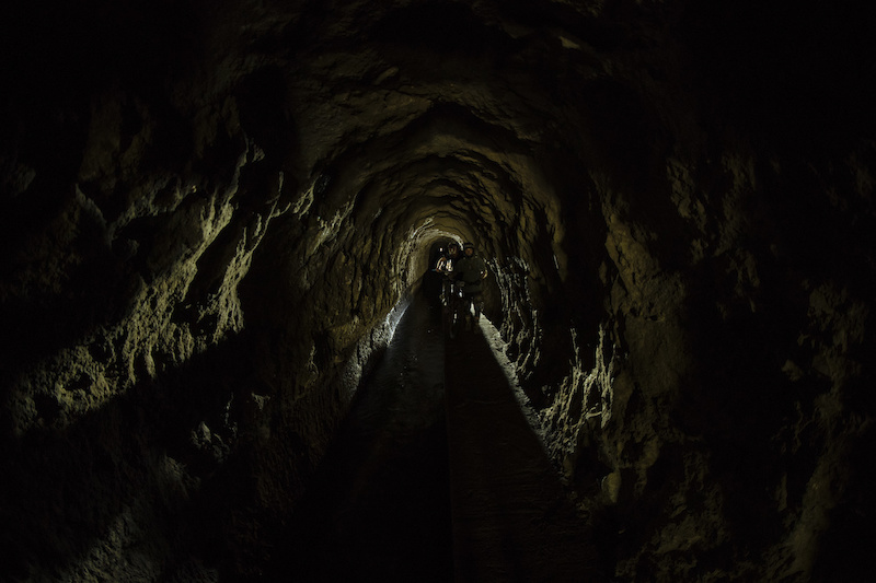The riders had to go through two of these tunnels. As wide as your bag, with a stream of water three feet deep to your side, pitch black and with a cue of riders in front and behind. Adventure at its best.