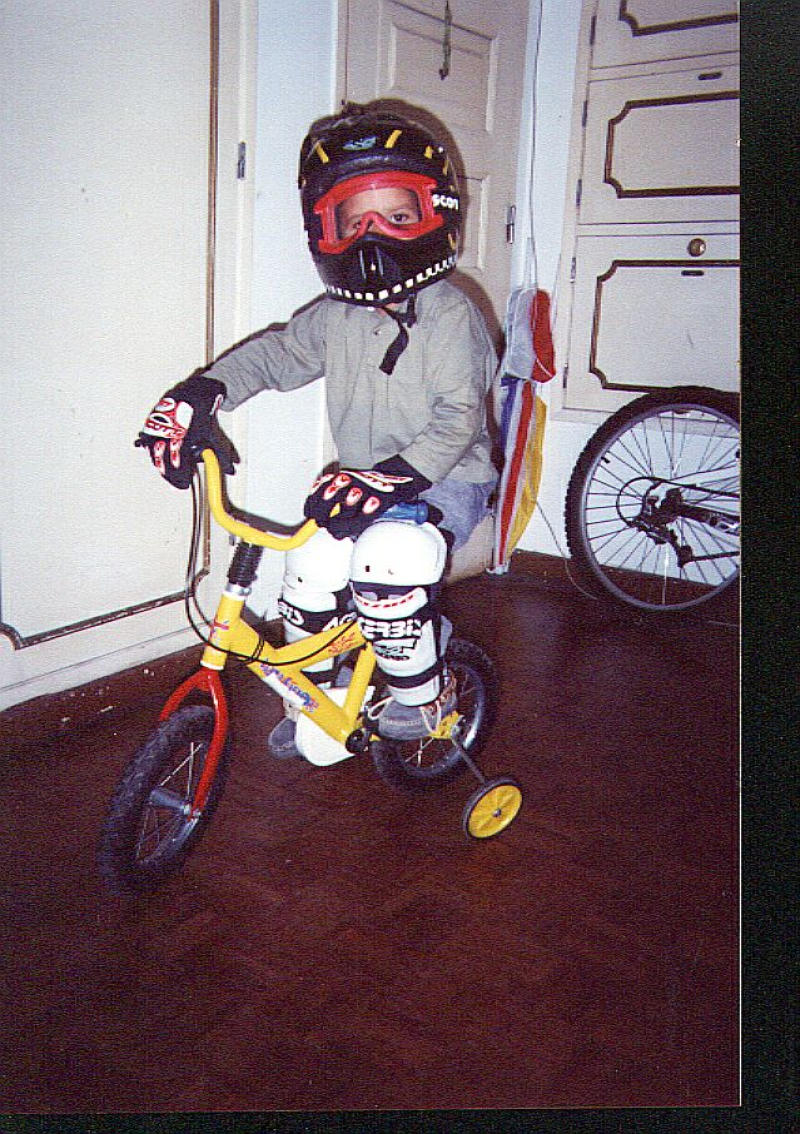 This is my son Wilson ready to atack the downhill course. This picture was taken last summer, he doesn't use the training wheels anymore. He says: "I'm not a baby anymore, i'm in the 4 year old class"