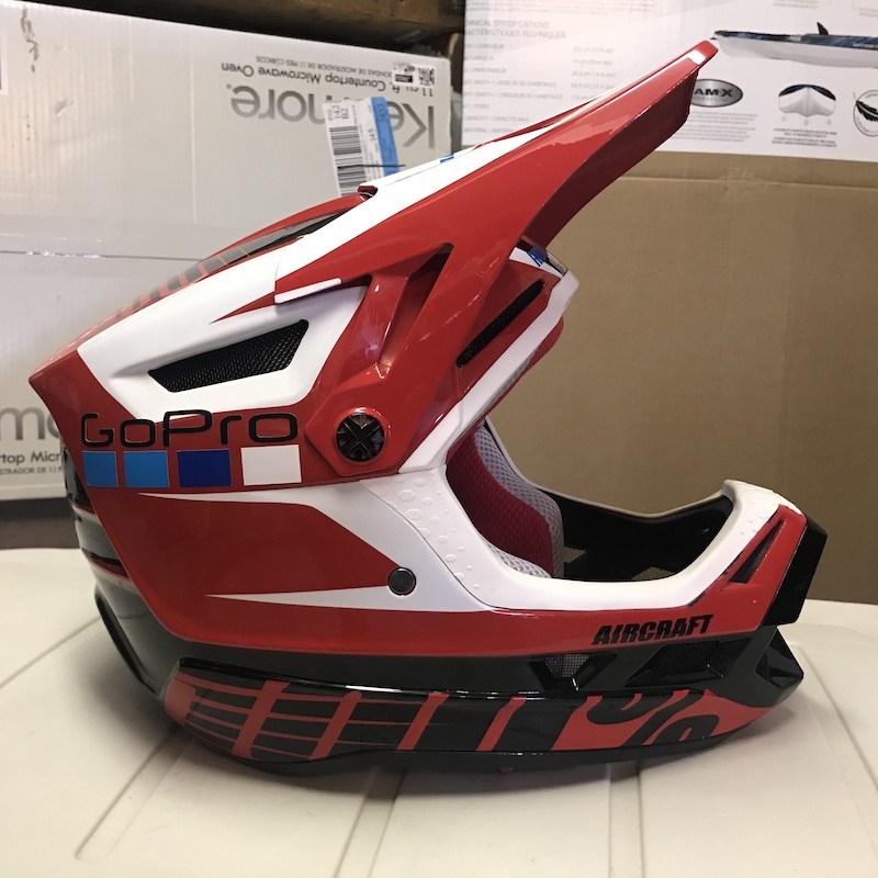 100% Aircraft Blazer Red helmet, size medium, for sale! Helmet has been damaged but is still okay to ride.