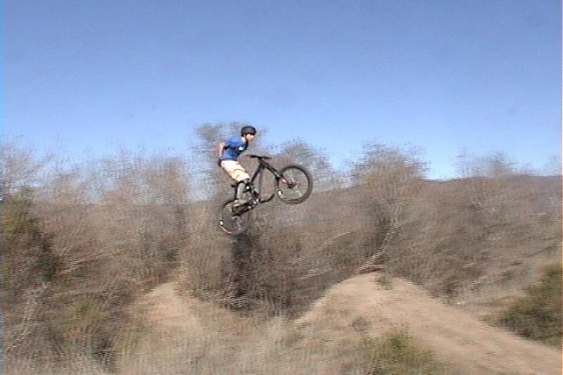Me doing a suicide no-hander that makes me look like I'm grabbing my butt. Oh well. I'm clapping it behind my back.