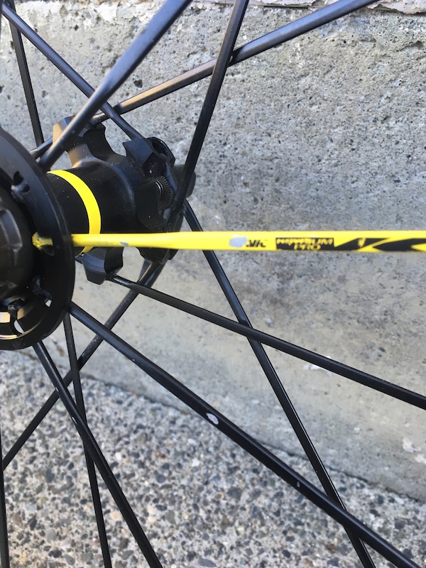 Minor paint flaking on two spokes