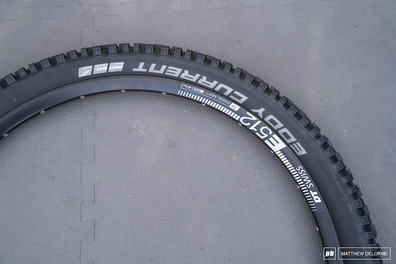 Schwalbe Eddy Current: Originally designed as an e-bike tire, this ultra reinforced front/rear combination has been embraced by aggressive riders who destroy wheels on a regular basis. Eddy Currents are sold in the grey, tough wearing compound, but this is the front specific tire with the soft-compound Supergravity DH casing and rubber.