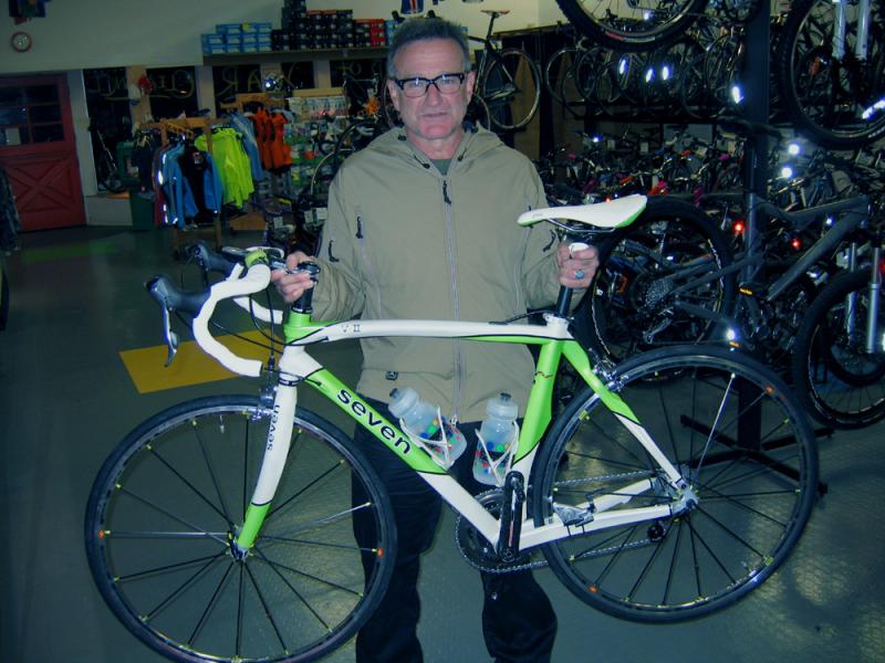 Mr. Williams with his custom 2008 Seven Cycles VII. He had to wait about 1.5 years to get this frame, and I got to build it for him. Believe it or not, we had that saddle in stock (it perfectly matches the colors of his frame). Matching water bottle cages, bar tape, saddle, wheels, and front and rear lights. Total weight: 17lbs. Total cost: around $8000