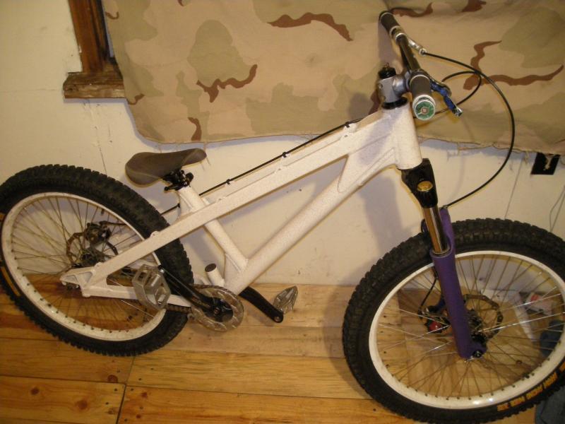 ORIGINAL EVIL IMPERIAL sand stone w/ dj2 in demolition purple and denim ody jr saddle wide bite 24 on halo sas 48 4 cross laced to a gusset free hub bb7 gusset bars axiom stem shadow conspiracy interloc II soon to be saints but for now tru-gay-tiv cranks