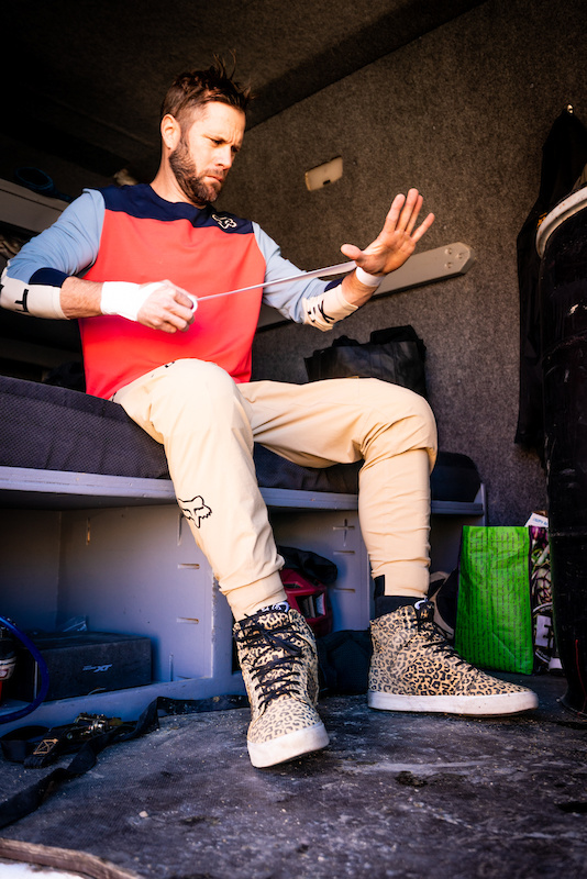 Kirt Voreis tapes his wrists before riding his mountain bike.