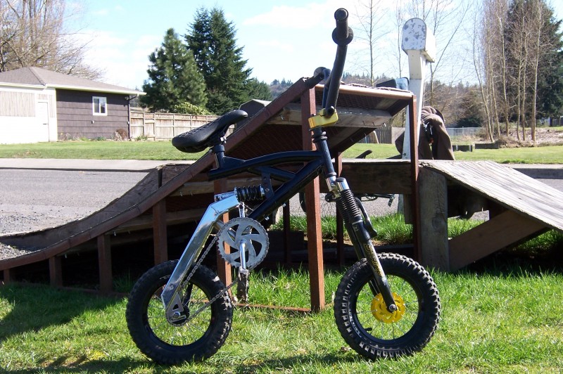 12" wheels, 16" swing arm, 16" crank, 26" rear shock, Tonka frame, Strike DH 24" forks Primo Casket stem, freecoaster, KMC light chain, RL Forklifter bars, ODSY Aitken sea, Primo seat post RL seat clamp, 2.4" tires, and sweet Mongoose Plastic pedals