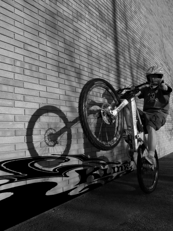 My friend and I have been practicing with black and white.  This is one that we took yesterday. All the credit goes to "CYCLIST-ABUSE" he was the one who took the photo and put the graffiti  in.