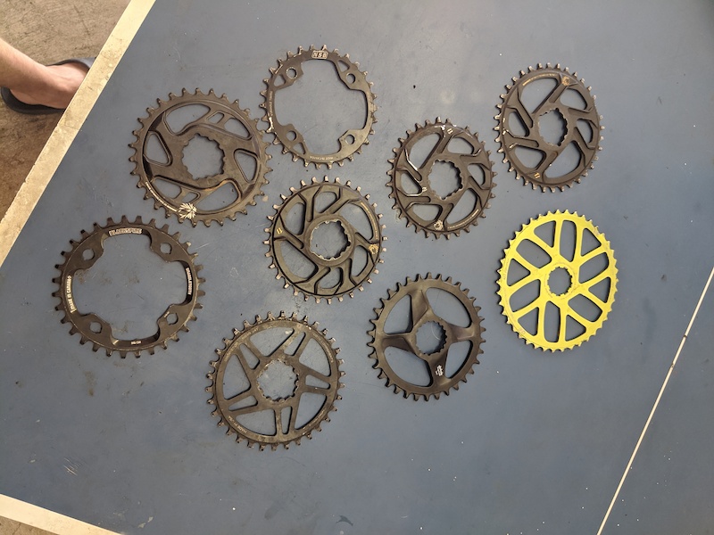 Handful of chainrings and extended range cog For Sale
