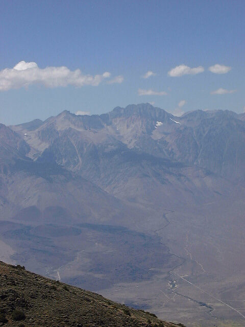 View of the Goodale lava field and cinder cones from above, from Mazourka Peak in the Inyo Mountains.  The Taboose Creek Road and CG are at lower right, the Goodale Creek CG is lower mid, Split Mountain (14k+) is the high peak background.