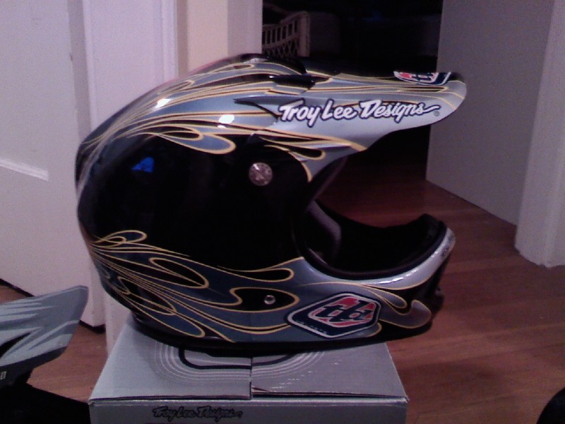 Side view of TroyLeeDesigns D2 Carbon Flames Helmet.
