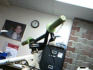 Webcam pic of my bike.Bright green grips.