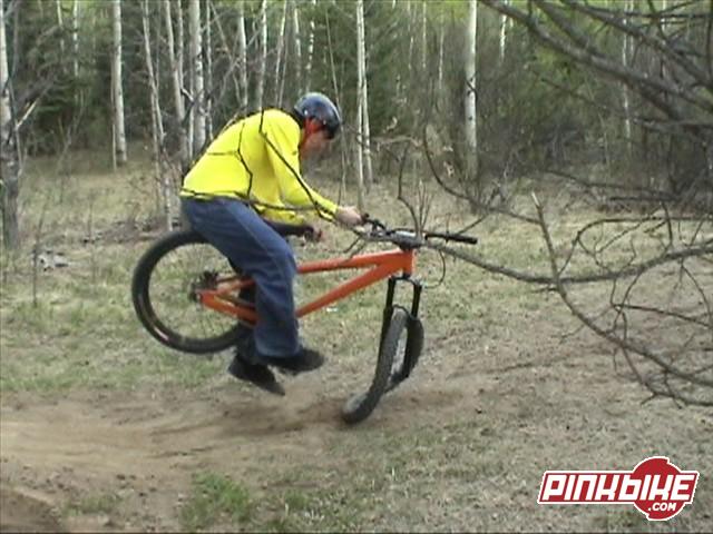 landing with front wheel turned sideways and turning his rim to a taco.