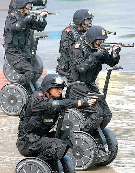 Chinese police on their Anti-Terror Assault vehicles