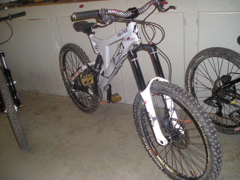 2006 specialzied big hit 1  
marzocchi 66 rc2x
fox van r
hayes stroker trails (gray with titanium color levers)
odi rouge
azonic strip bars
funn rippa
sun single tracks laced to dmr revolver and specialed hubs)  
panaracer fire fr tires
raceface evolve dh cranks with e13 supercharger bash and diabolus chainguide
crankbrothers 5050xx
bontrager big earl seat
sram x7 drive train