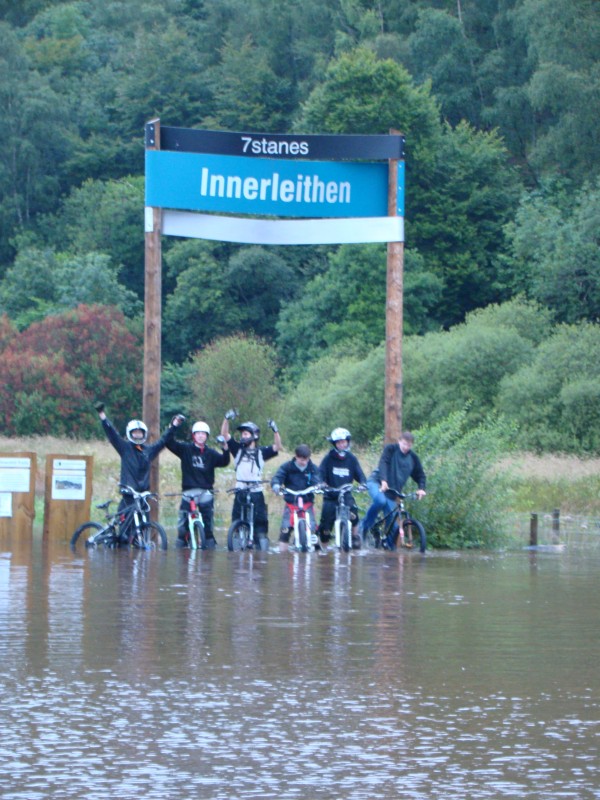 Standing under the Innerleithen sign up to our knees in water!!