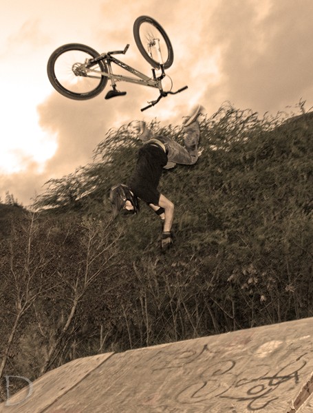 bailing a back flip. didn't end too bad. except for my bike trying to kill me on it's way back down. pic by Daniel.