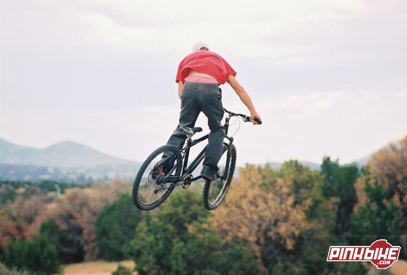 he's first time on a mountain bike and hes already dirt jumping.(bmx racing background)