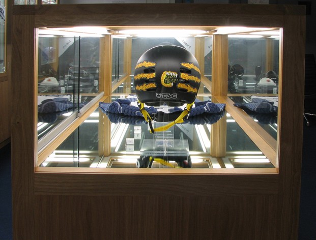features TSG Helmet and Knee/Shinpads in the "protect" part of the exhibit.