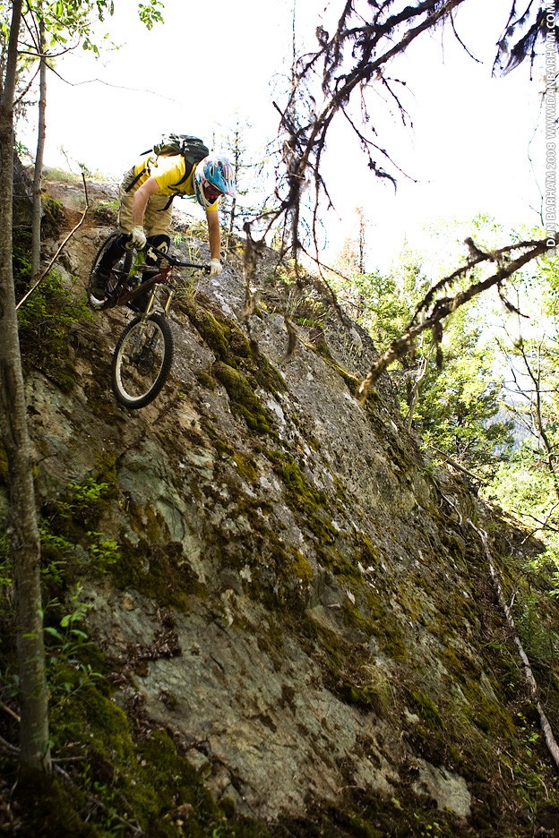 Mitch Chubey riding a rock face