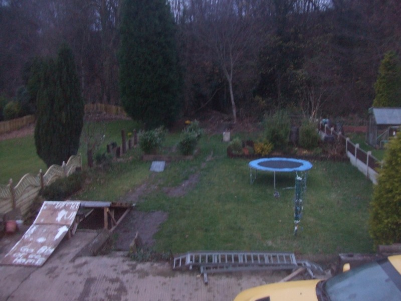 My garden, complete with wooden ramp and plasi over the border, and my dirt jumps almost in view....