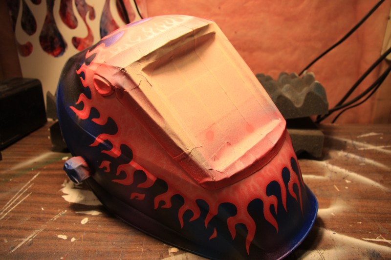 process pics of a welders helmet i am working on. its very pink, as its been made for a female welder. kinda simple design but interesting enough to paint.