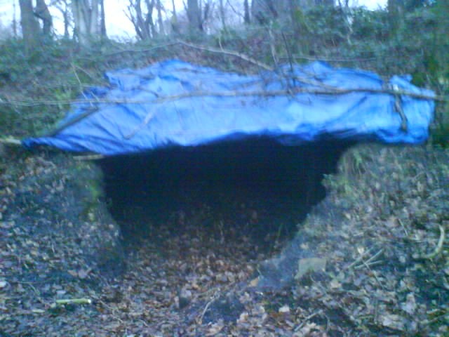 This is the new rain hut, using the hole we dug all the dirt out of, :P