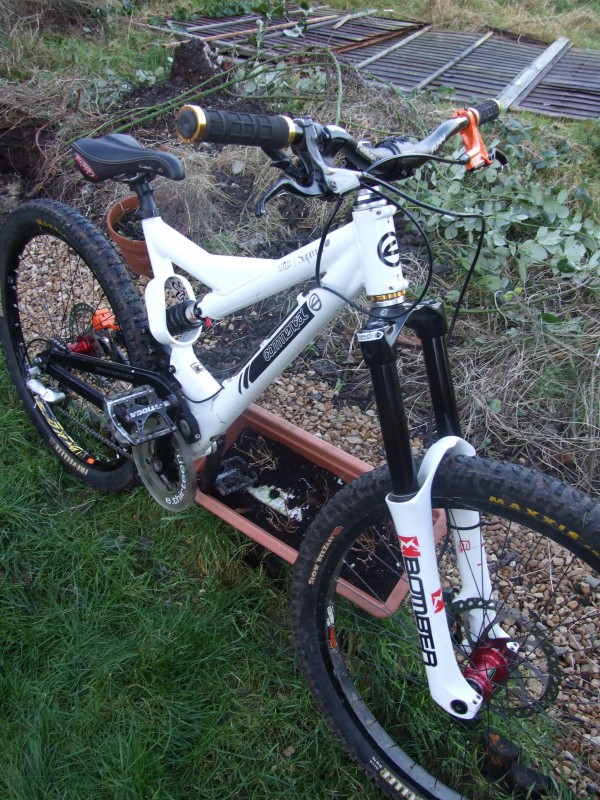 Pictures of my commencal mini Dh with 66 sl and other cool parts :P