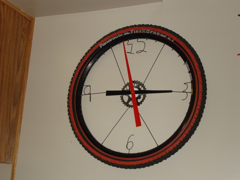Here is my bike wheel clock.  I used my rim from the SX trail wheel, a few spokes for the numbers and to hold the sprocket in place, a clock motor and some big clock hands.  then topped it off with an old tire.  gets everyones attention!
