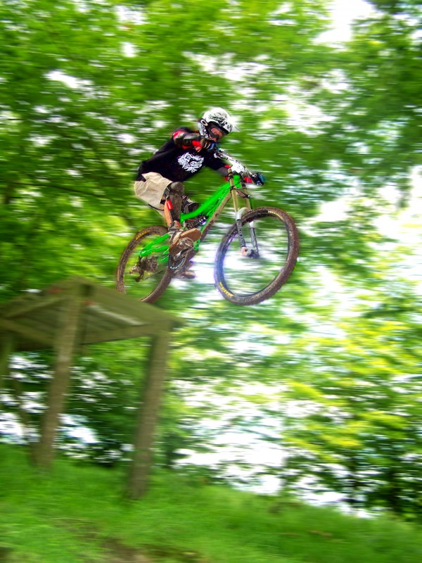 chuck coming off the drop at the UK bike park, Blandford