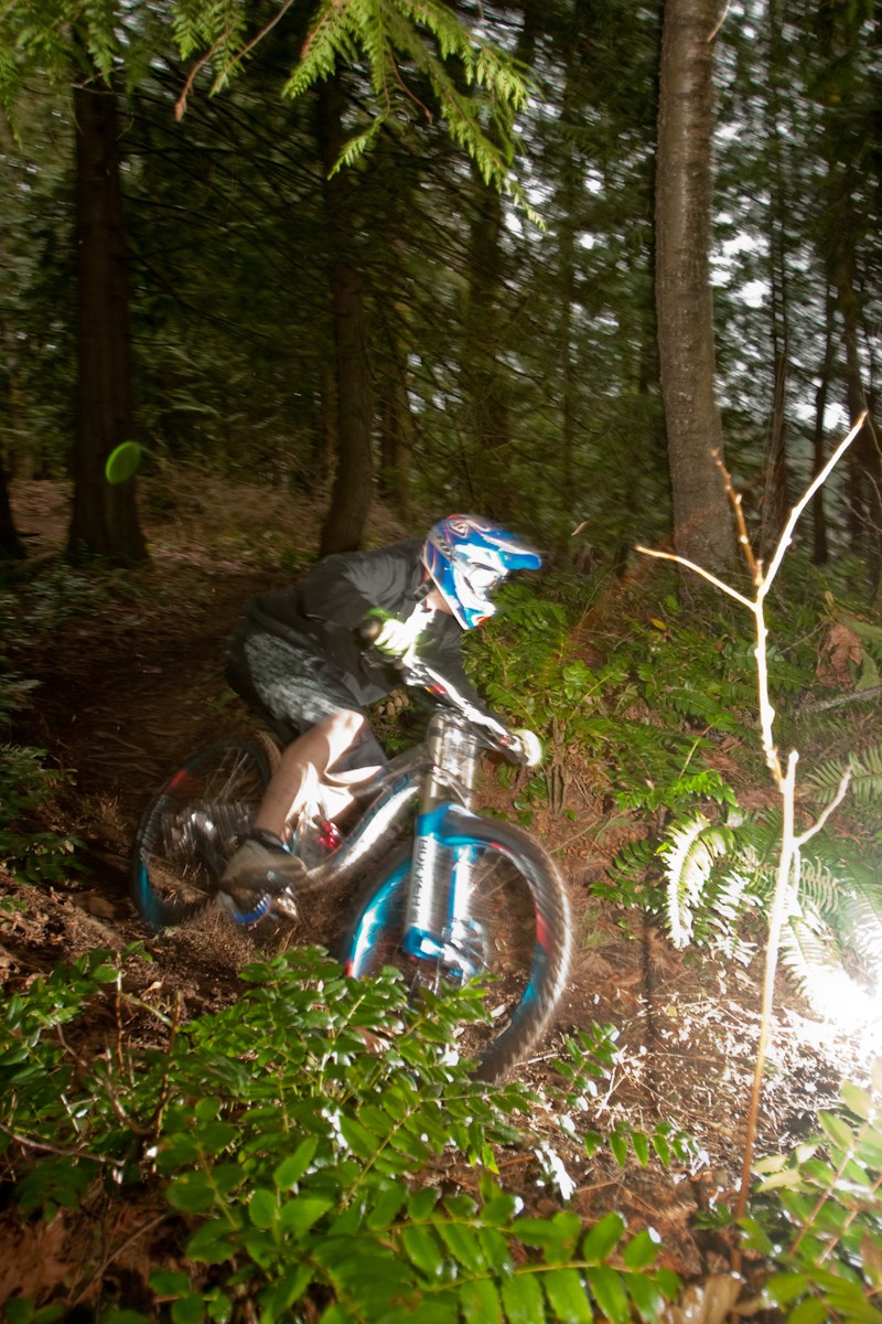 Eric Ripping it up on his new Norco Team DH, while i practice taking shots with external flash's.
Thanks for hiking so many times buddy!