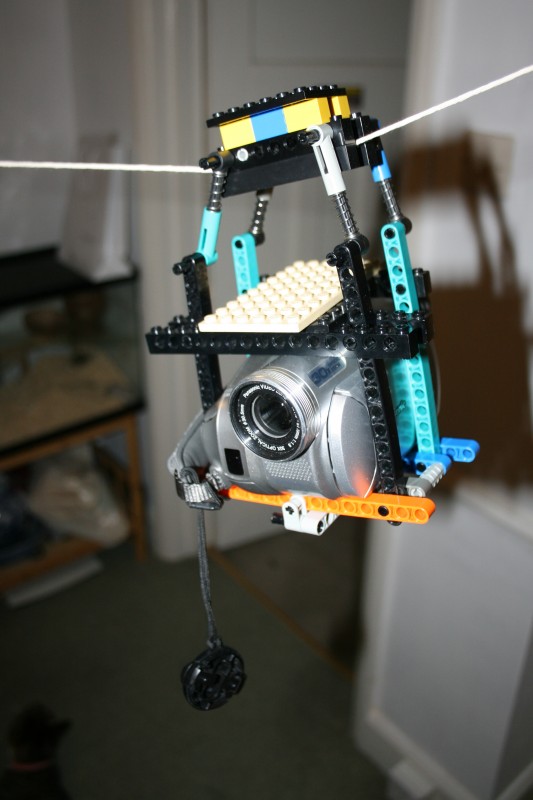 zip wire camera made out of lego

small test clip in my garden: http://www.pinkbike.com/video/69248/