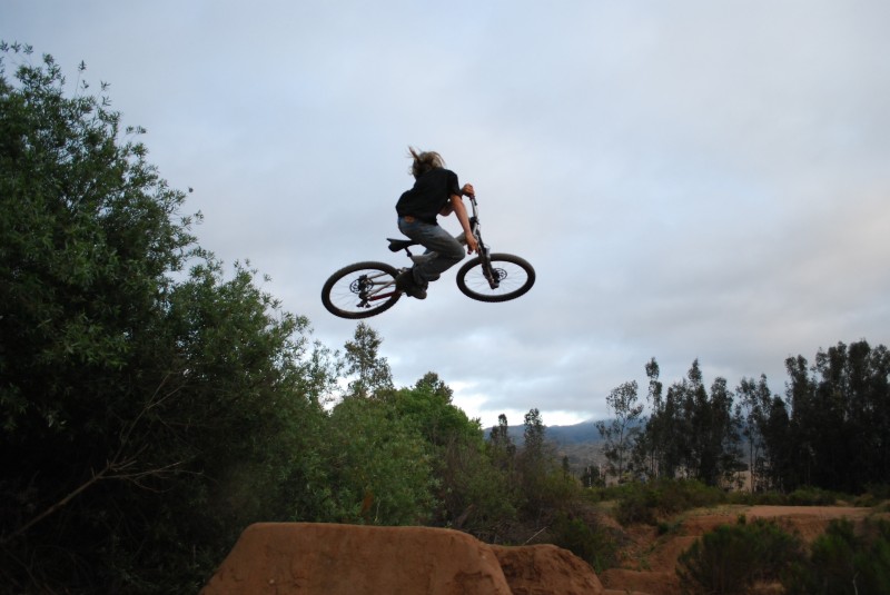 Just having a little session on my DH bike, flatty whip. right after this pic, I went a little further, and brought it back to where this position is, and then slid down the landing side ways lol.