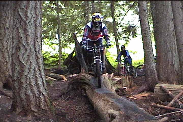 Riding down a wet log. It was raining all day long.