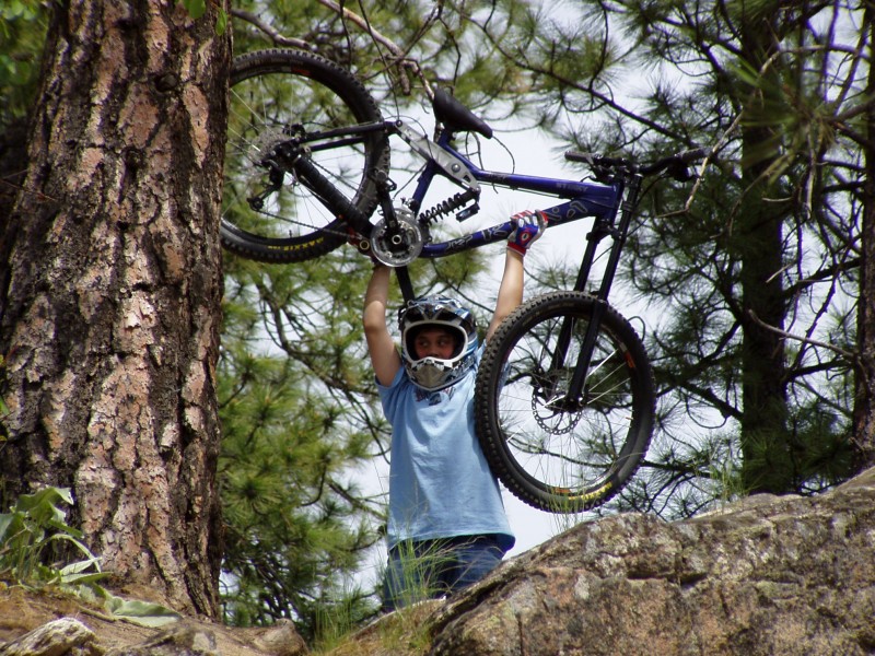 Luke holding up his bike.