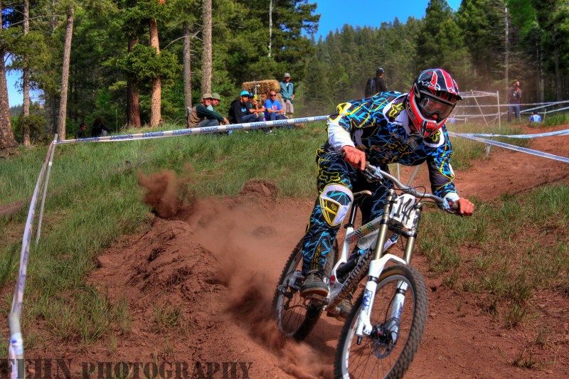 HDR of rider 144 schralping the berm in the home stretch.