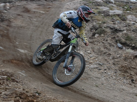 A rider leans into the berm on opening day - June 13, 2009 - at Trestle Bike Park